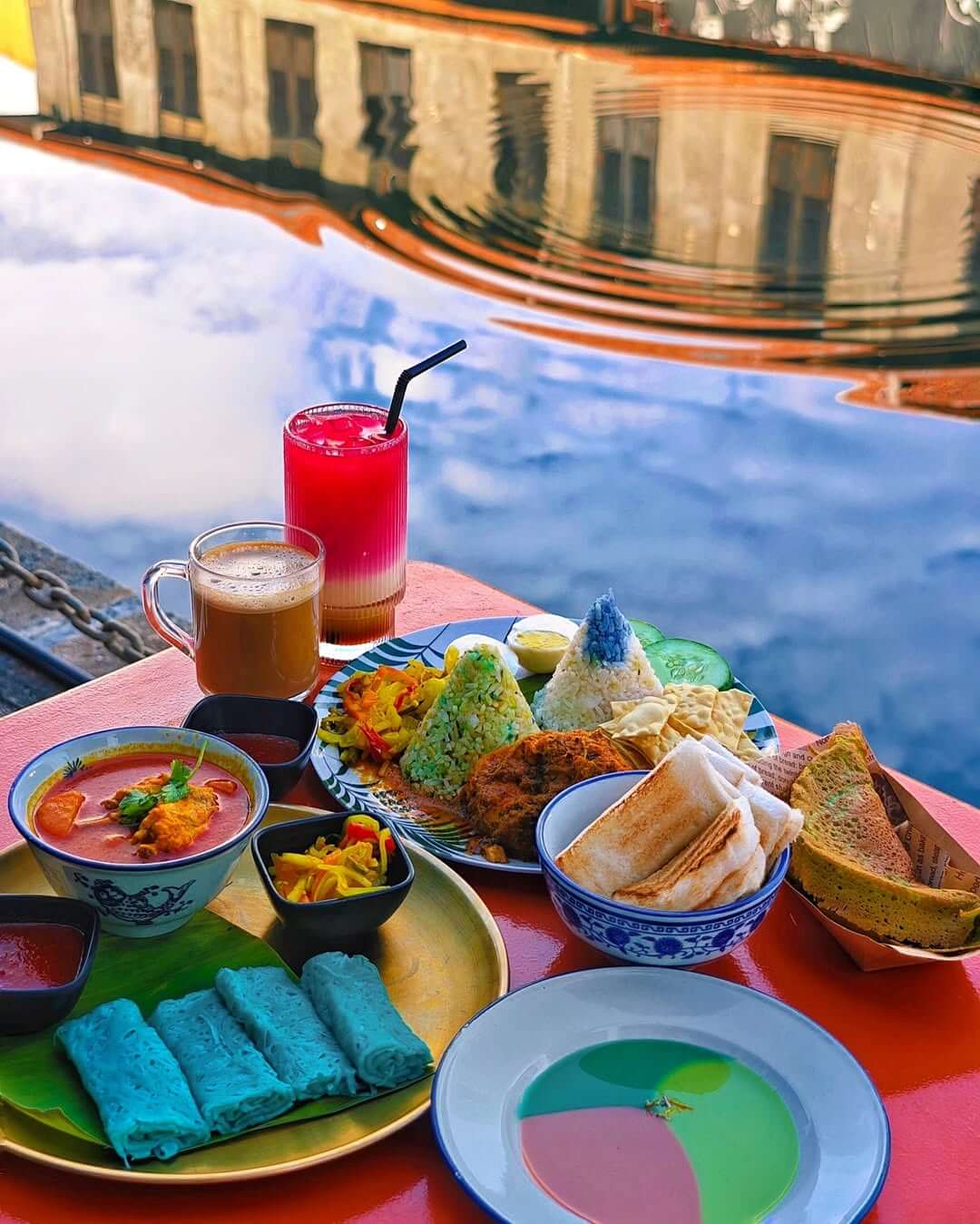 colorful food at a river view cafe in melaka